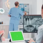 A woman in front of a 3D Imaging machine