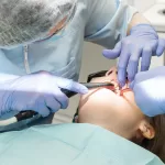 An oral surgery patient being treated