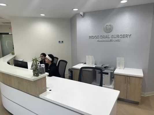 Modern, welcoming reception desk at Ridge Oral Surgery clinic emphasizing patient comfort and advanced care.