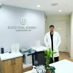 Dr. Mehrotra greets patients at the reception of Ridge Oral Surgery, offering a warm welcome and expert care.