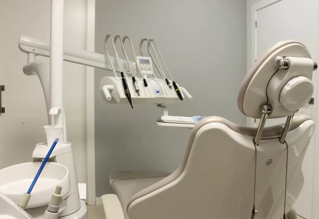 A modern dental chair at Ridge Oral Surgery in Basking Ridge, NJ, equipped with tools for a bone graft and implant procedure.