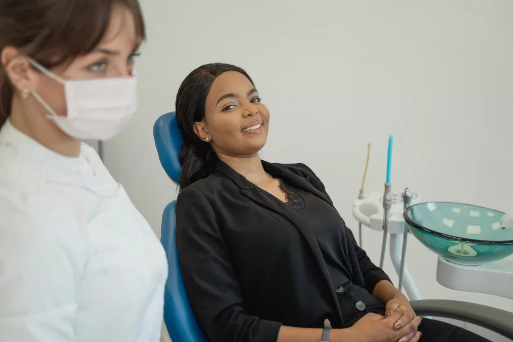 A dentist and patient at Ridge Oral Surgery in Baskin Ridge, NJ, discussing treatment in a modern, professional setting.