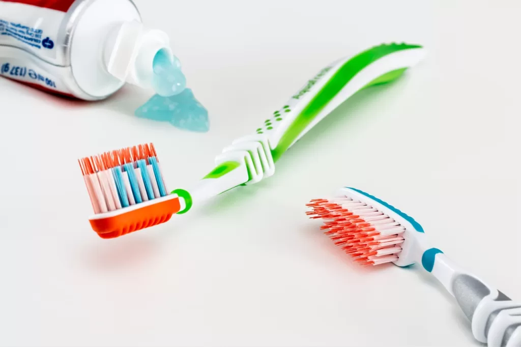 Toothpaste and a toothbrush are essential tools for maintaining oral hygiene, helping to clean teeth and prevent decay.