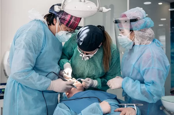 Doctors operating on a patient undergoing a surgery