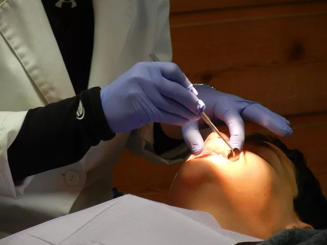 A dentist examining a patient's teeth