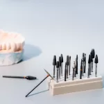 Dental tools, including burs and a dental model, used in the placement of Zirconia Implants.