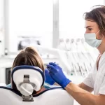 Surgeon performing dental treatment