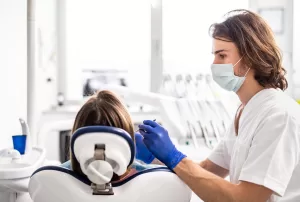 Surgeon performing dental treatment