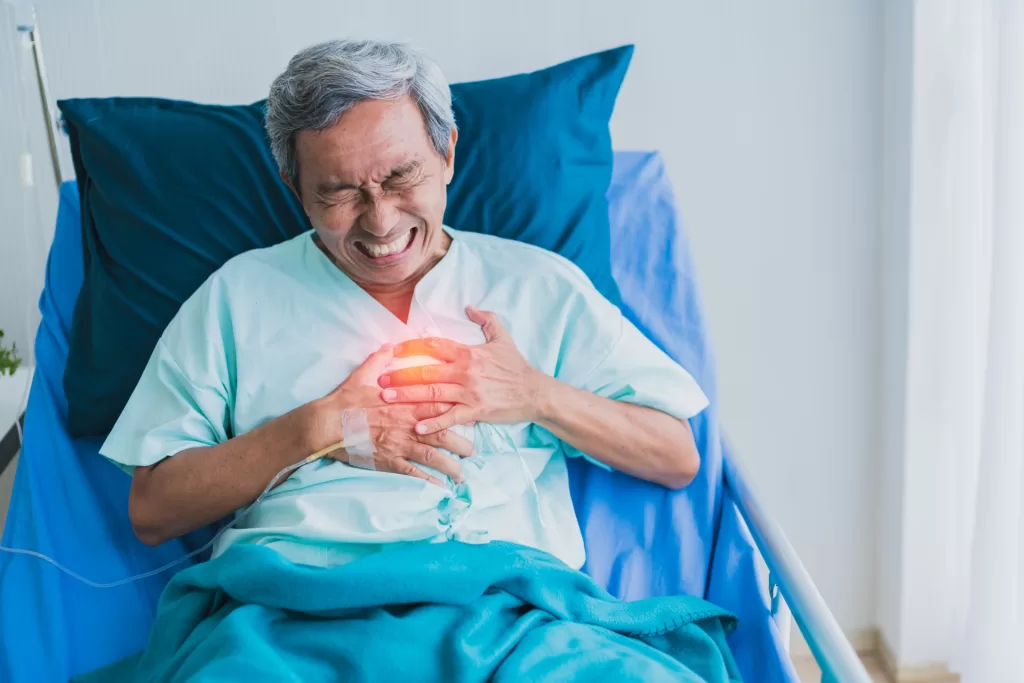 A senior person affected by heartburn and pain.
