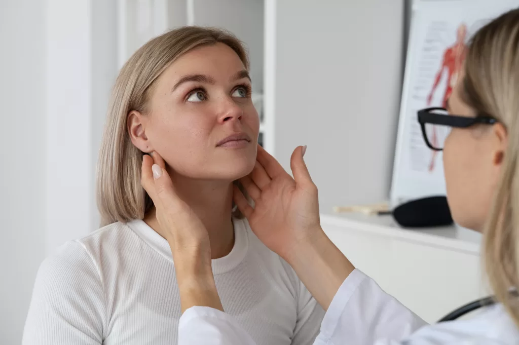 A dentist checks a patient's jaw to diagnose pain and related issues accurately.