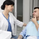 Dentist performing a check-up on a patient at the Ridge Oral Surgery clinic, assessing bone health and oral condition.