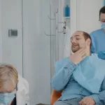 Patient consulting with oral surgeon about dental implants after a healed jaw fracture at Ridge Oral Surgery.