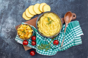 Soft recovery foods including mashed potatoes and scrambled eggs prepared for healing after tooth extraction.